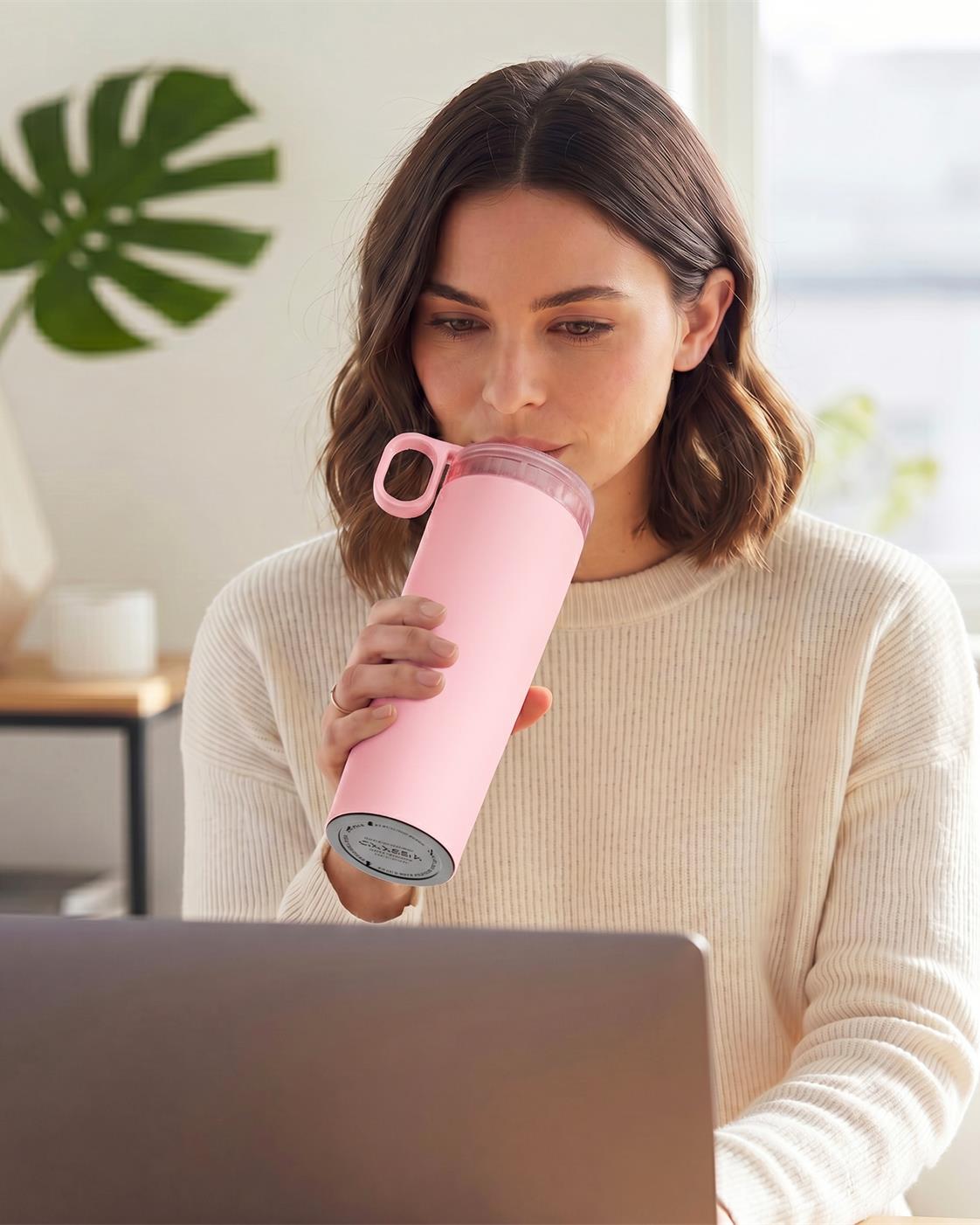 Pink KissKind cup beside soft desk styling