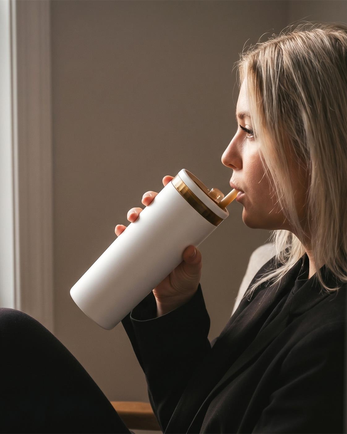 White KissKind cup in a warm window lifestyle scene