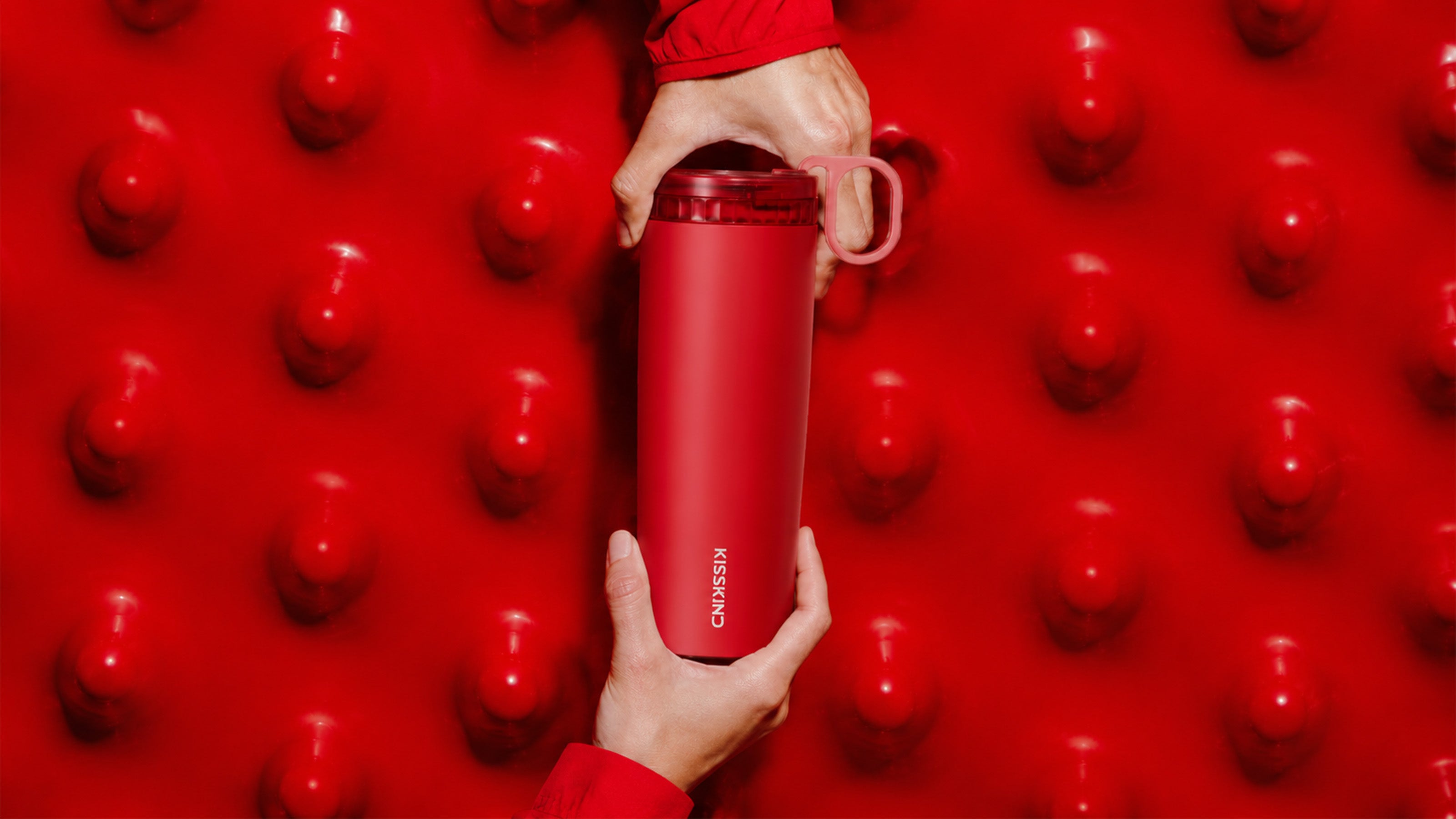 Red Kisskind cup in a bold red still life