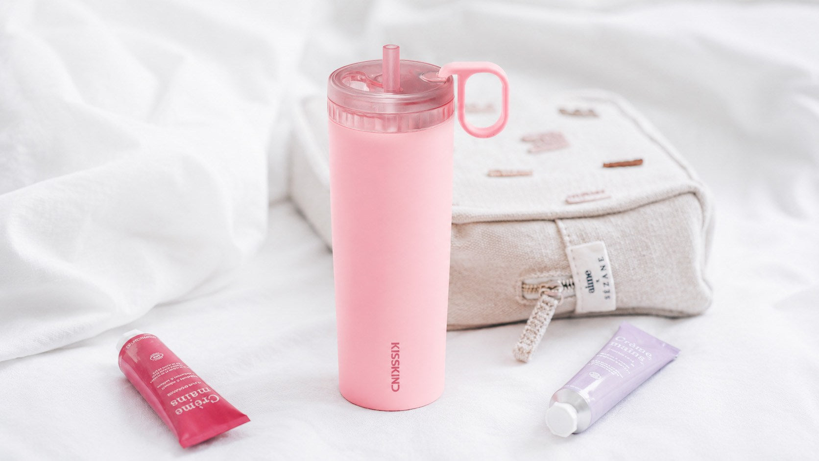 Pink Kisskind cup styled in a soft everyday scene