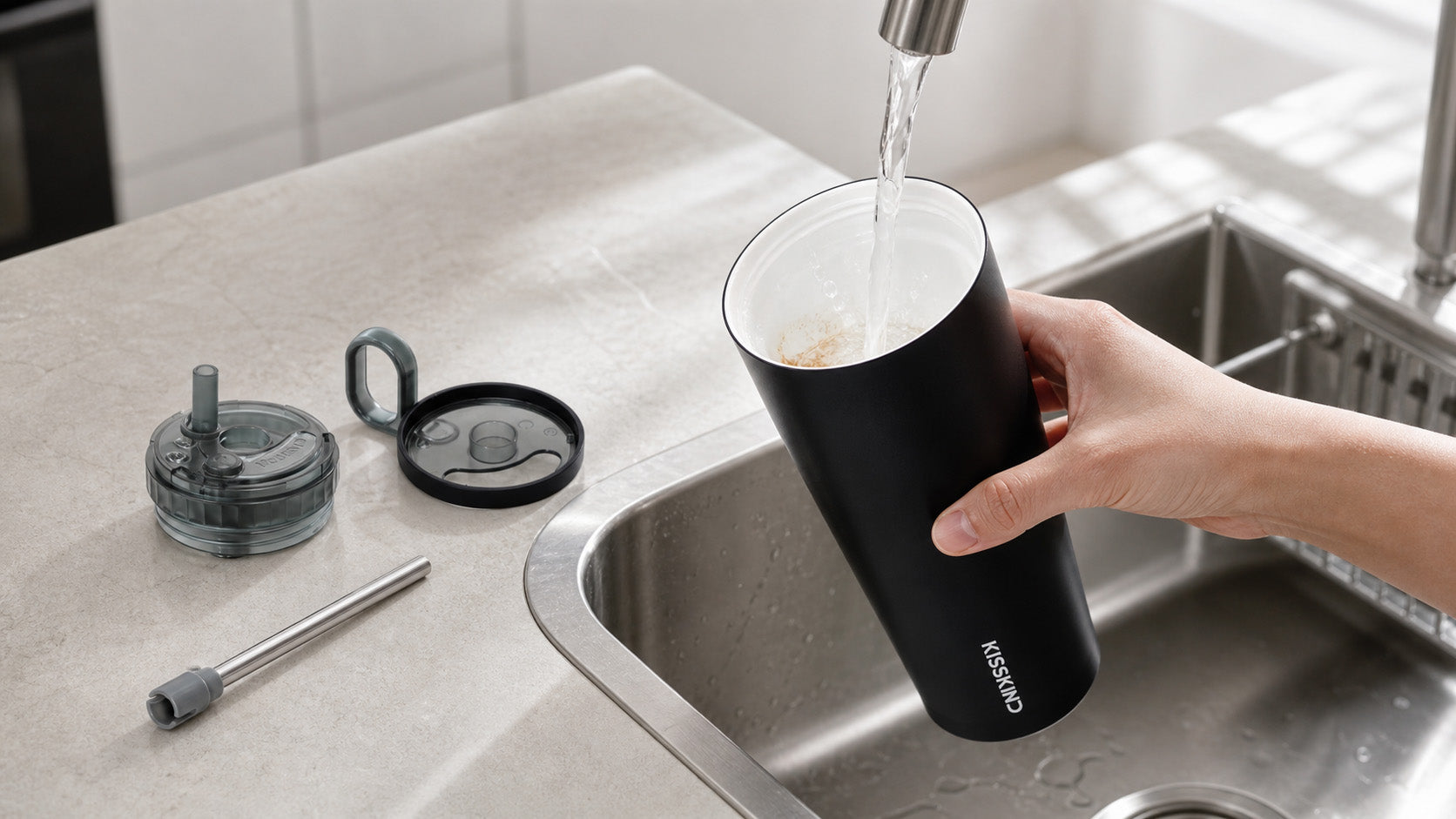 KissKind cold brew cup parts being cleaned near a sink