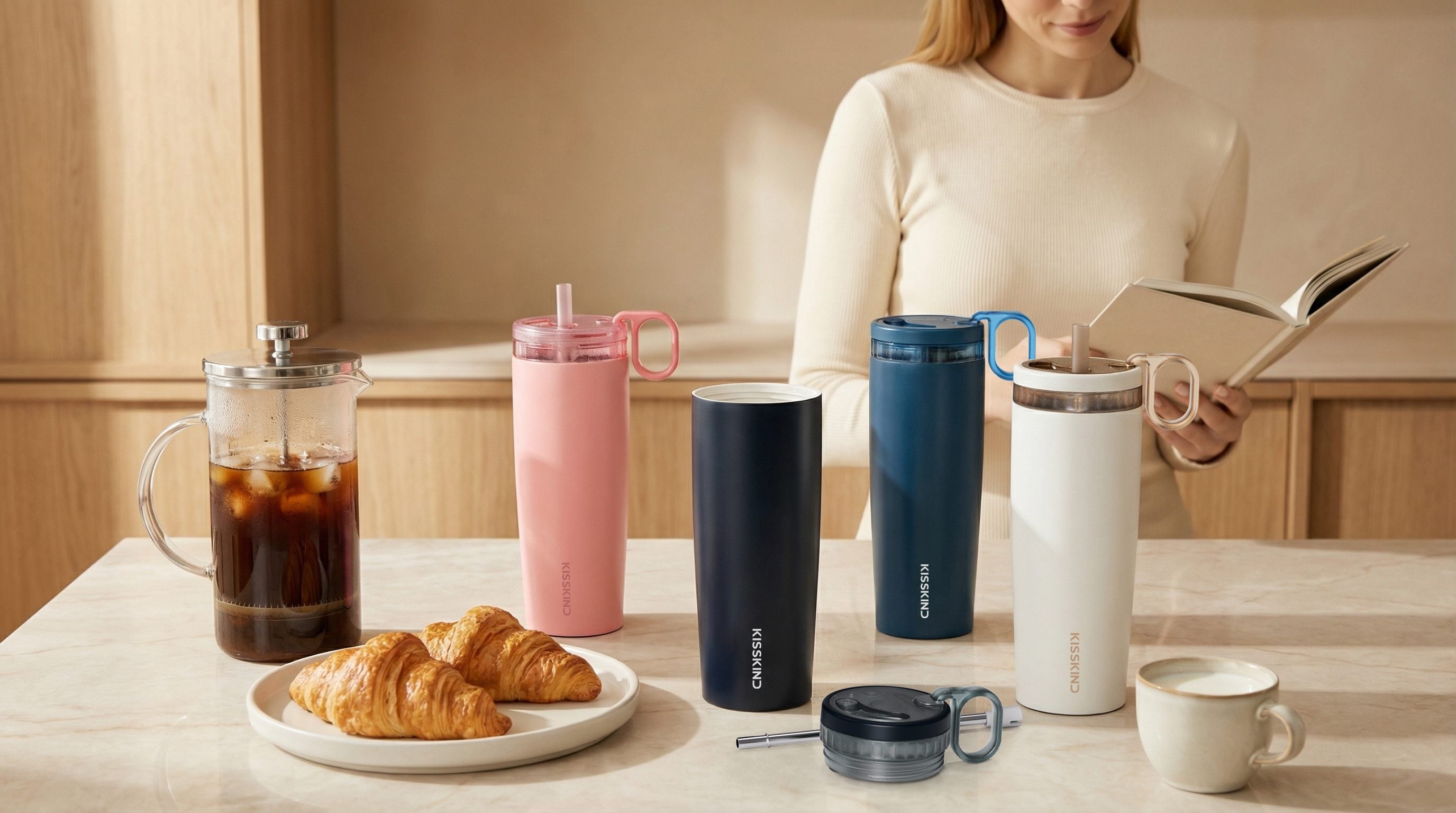 KissKind current iced coffee tumbler line in a breakfast setting.