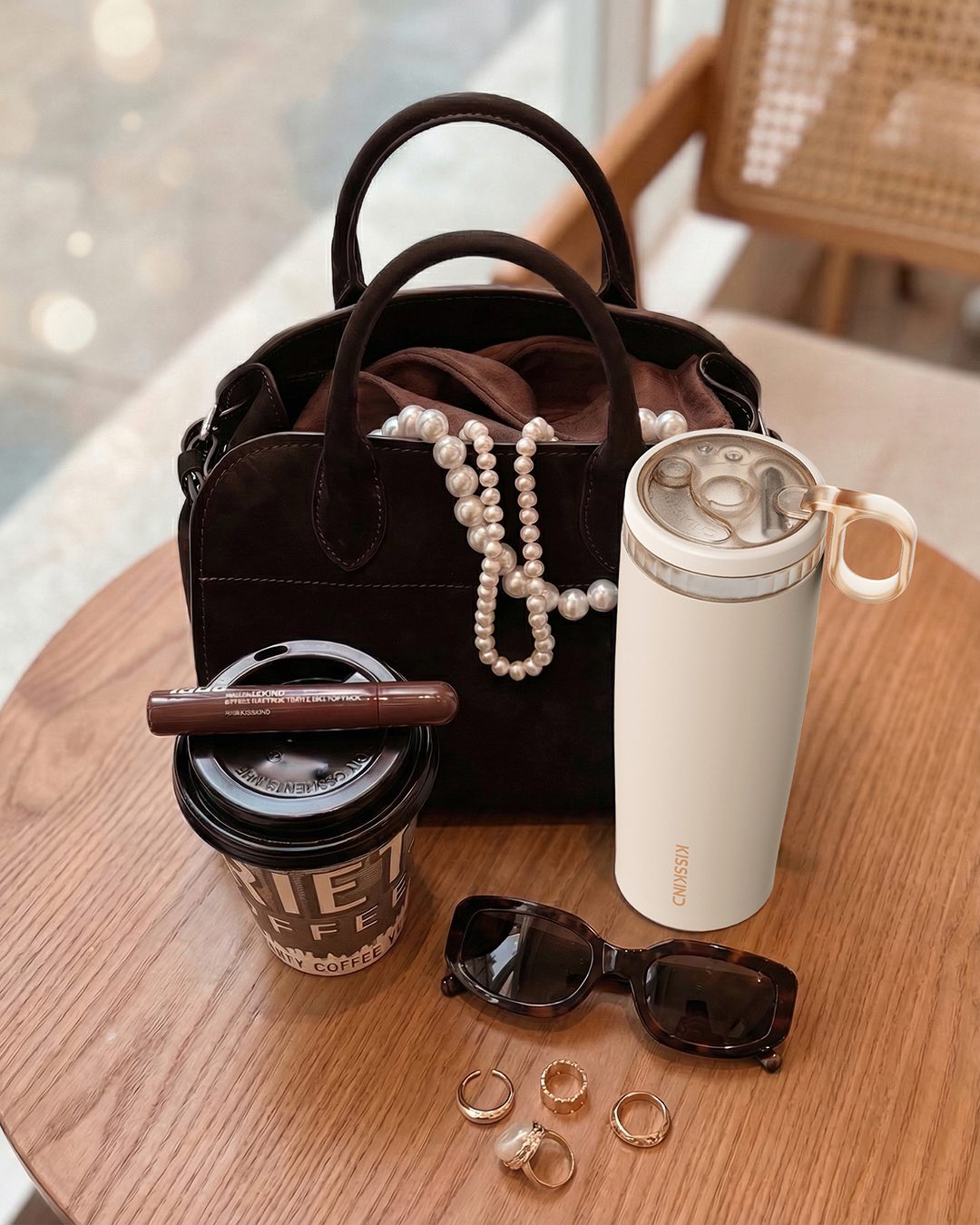 Coffee beside daily carry items