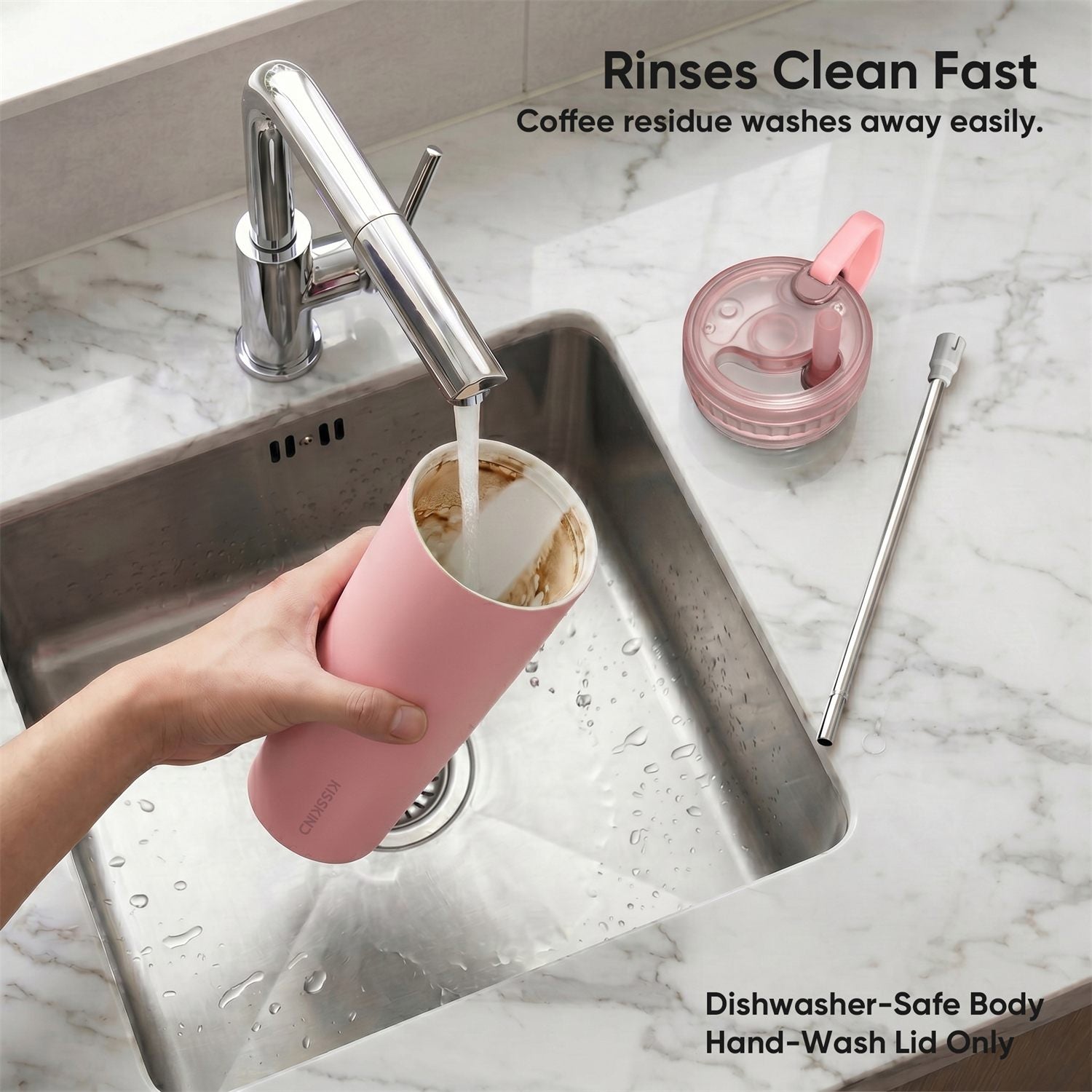Pink reusable iced coffee cup rinsing clean.