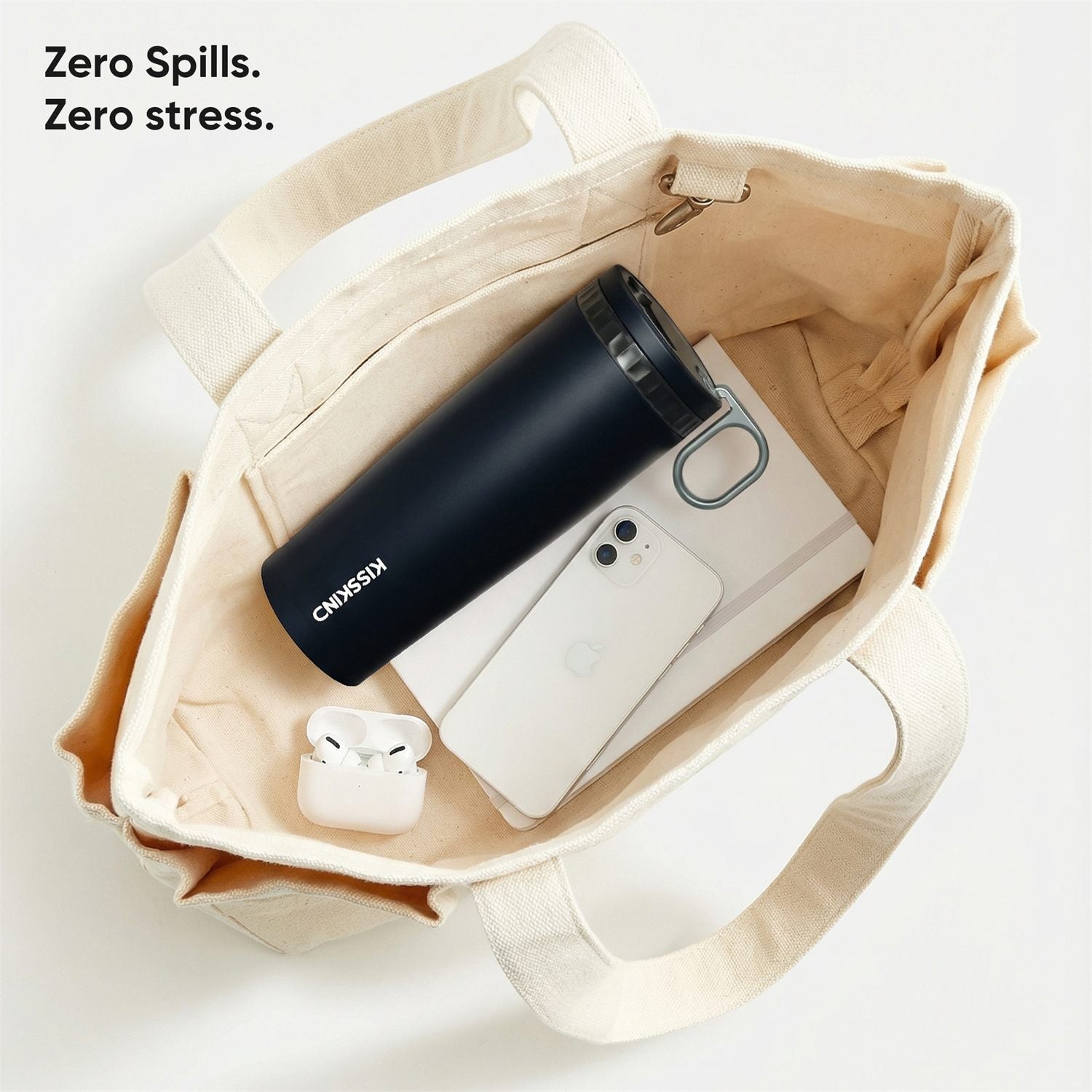 Iced coffee cup beside daily carry items.