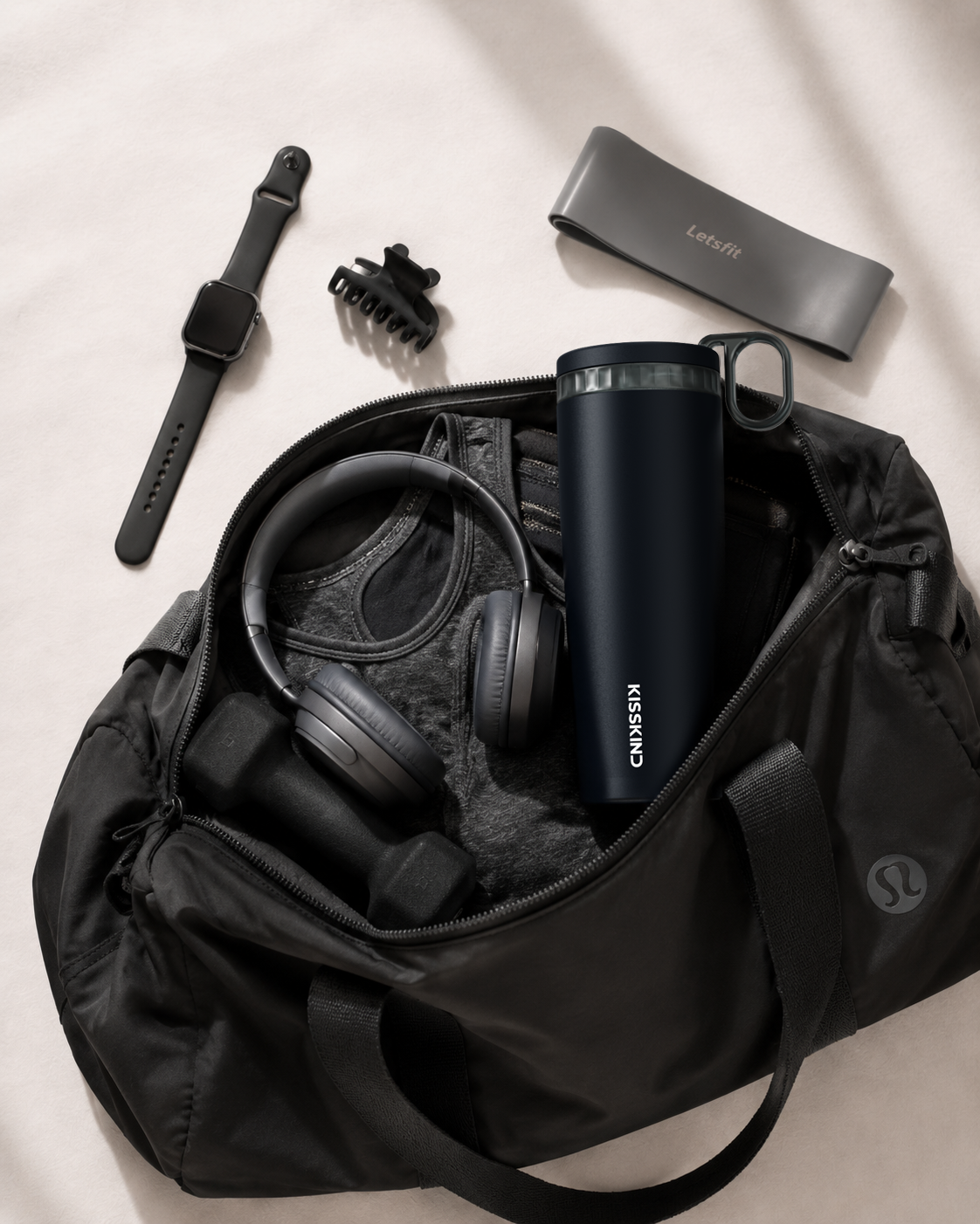 KissKind tumbler carried with a black daily bag