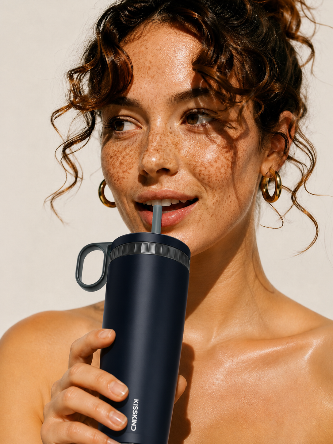 KissKind cup with straw open for sipping