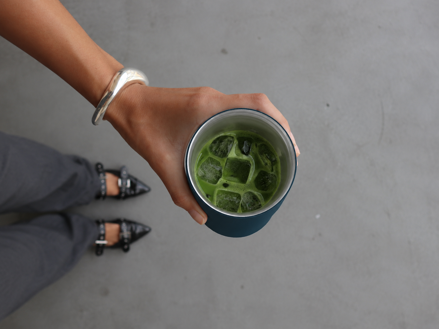Top view of iced coffee in a KissKind cup with room for ice