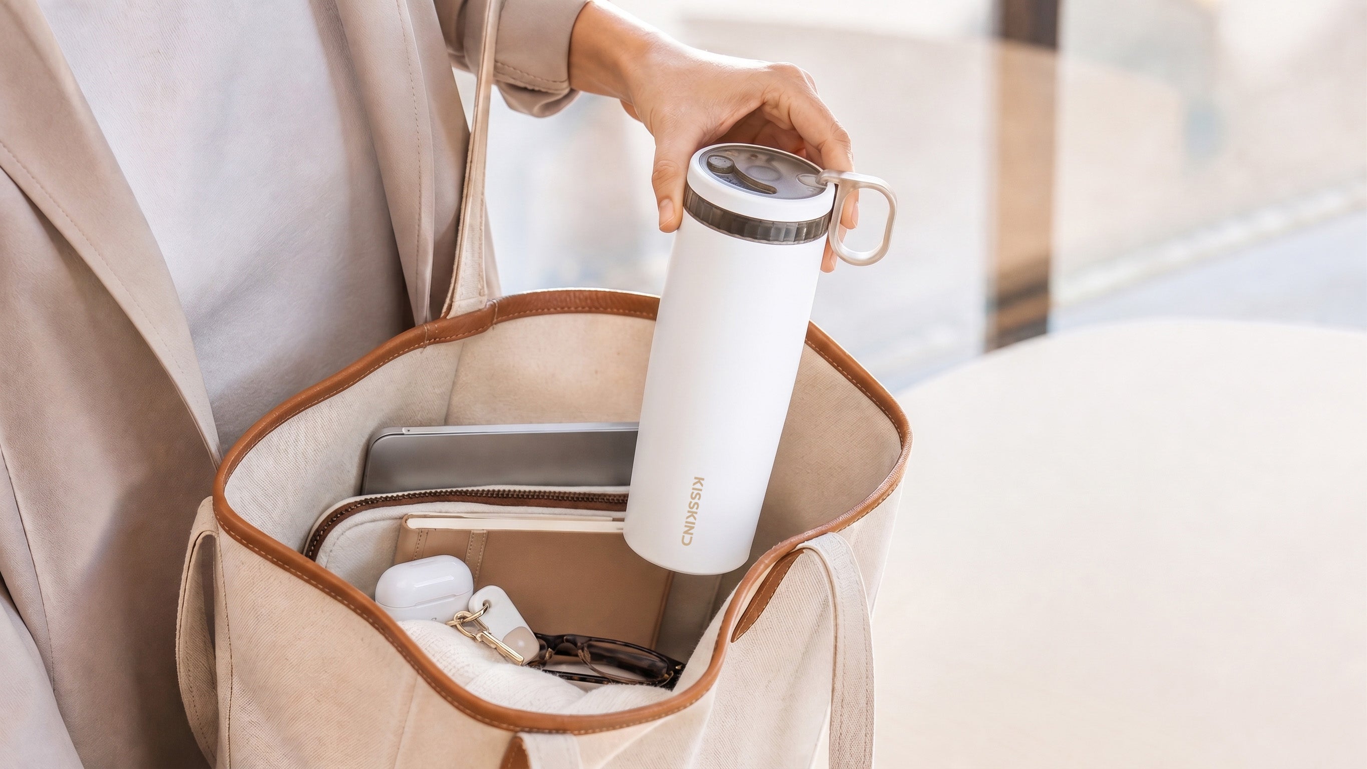 KissKind iced coffee cup packed inside a daily carry bag
