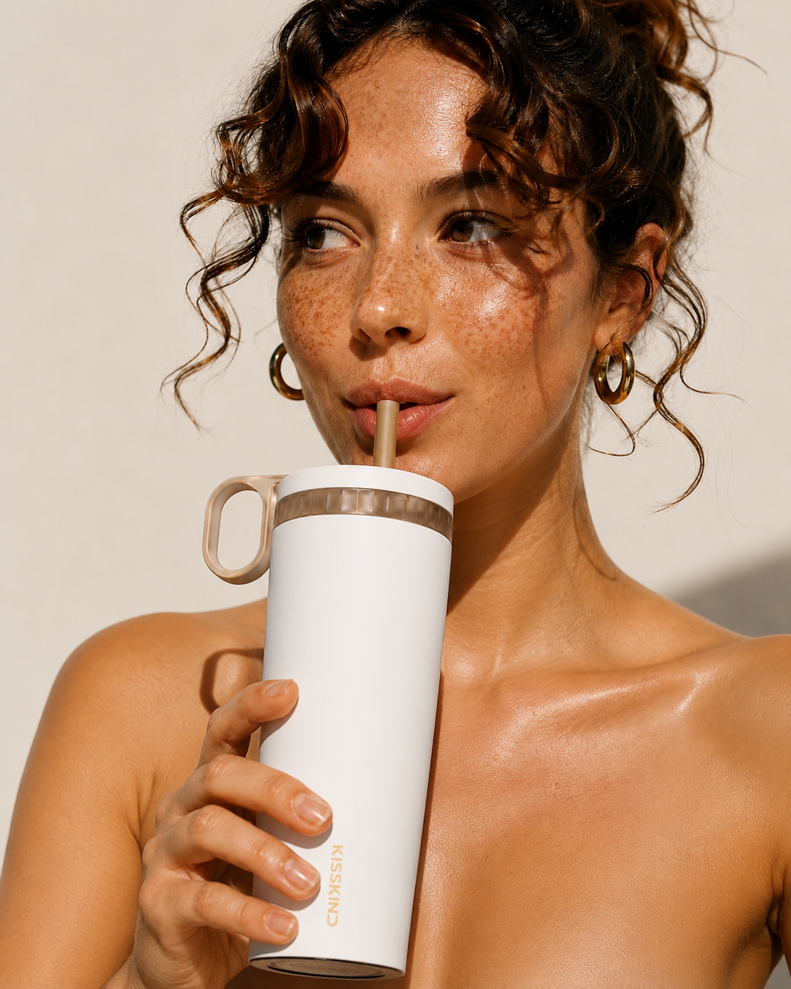 Fresh iced coffee poured over ice inside a KissKind cup