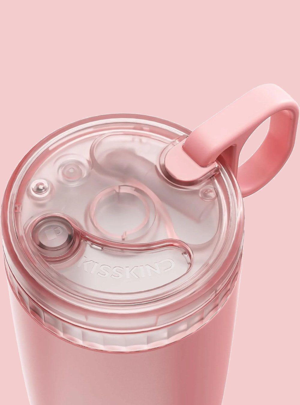 Pink cup lid close-up, straw tucked away